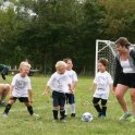 Emily coaches her team on how to do a drill